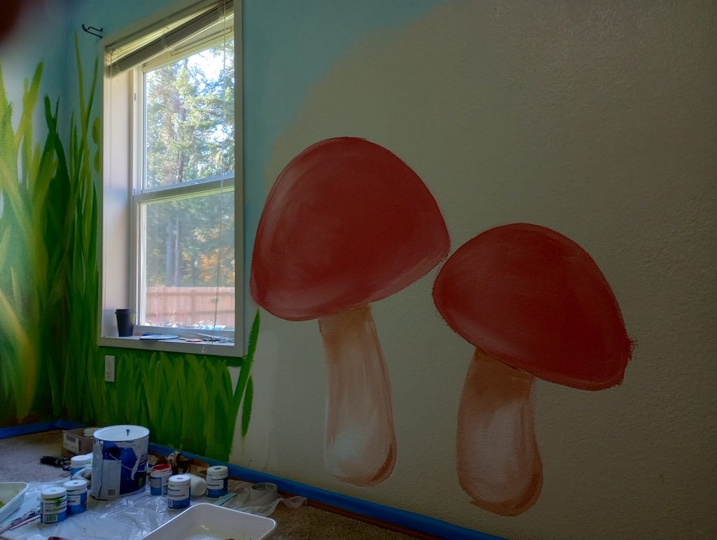 half painted mushrooms on a wall