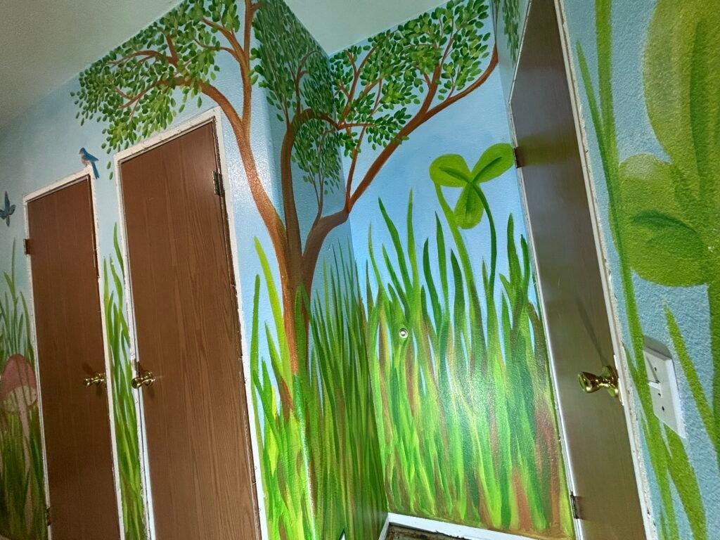 a large painted tree in the mural