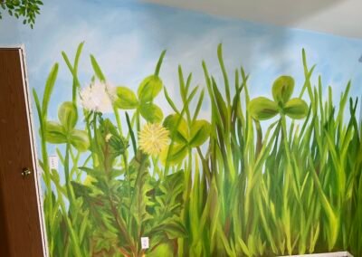 large grass and flowers painted on the wall