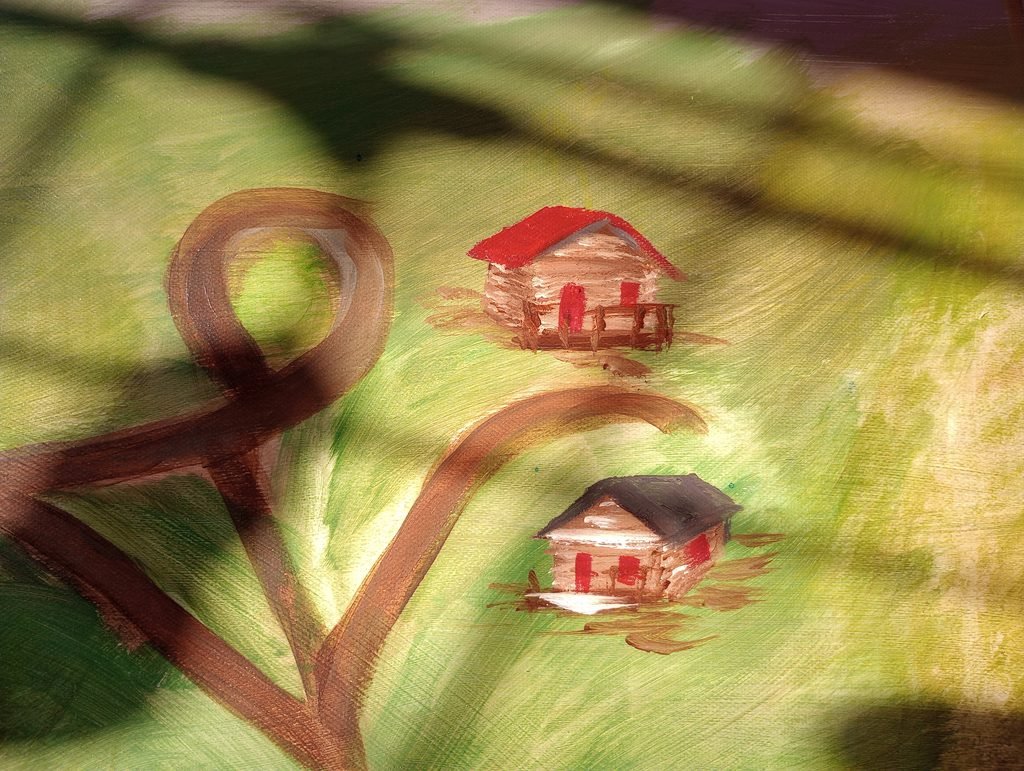 a small painting of a cabin on a map