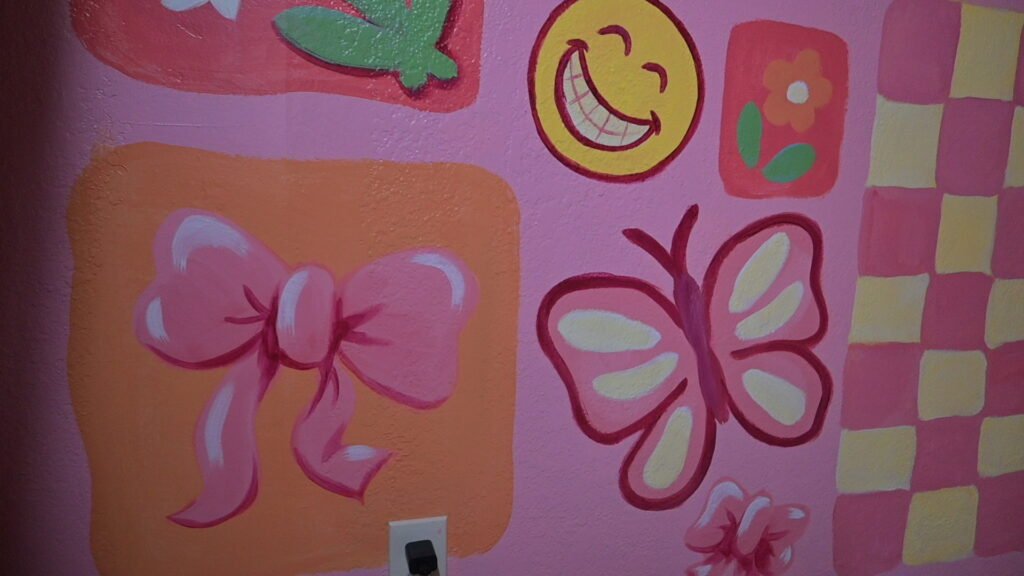 a close up of some of the paintings on the mural